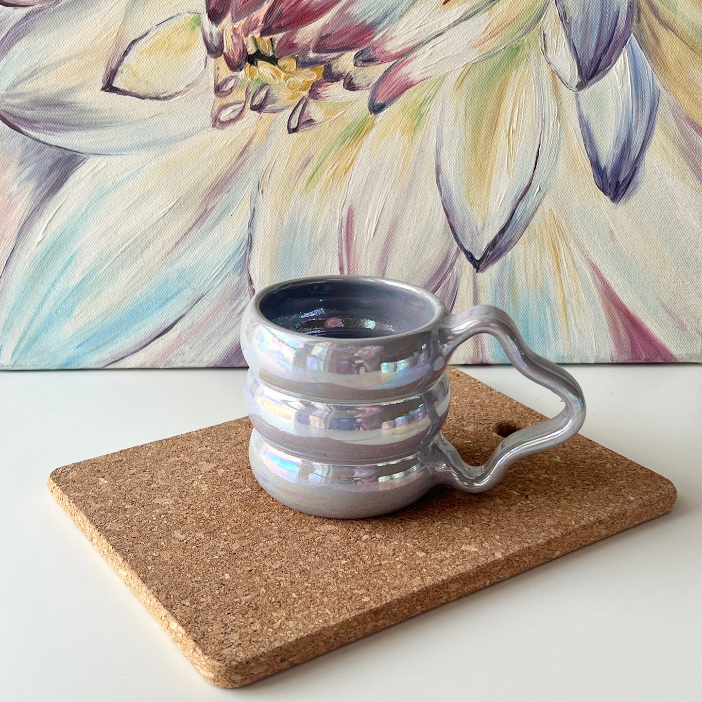 Purple ceramic mug featuring a glossy luster and bubbly form.