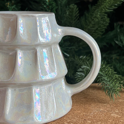 Close-up of artisan hand-painted details on Christmas mug in white